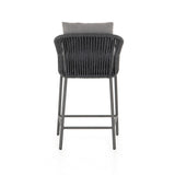 Featuring Porto Venao Charcoal Outdoor Bar & Counter Stool by Four Hands at Amethyst Home. The perfect place for outdoor daydreaming. A beautiful rope-based design is woven across a durable aluminum frame in a rich bronze finish. Topped with a wide cushion and throw pillows, all upholstered in 100% olefin, known for its UV-resistant, water-repellent and quick-drying abilitiesBar Stoo. Amethyst Home provides interior design, new construction, custom furniture, and area rugs in the Austin metro area