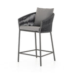 Featuring Porto Venao Charcoal Outdoor Bar & Counter Stool by Four Hands at Amethyst Home. The perfect place for outdoor daydreaming. A beautiful rope-based design is woven across a durable aluminum frame in a rich bronze finish. Topped with a wide cushion and throw pillows, all upholstered in 100% olefin, known for its UV-resistant, water-repellent and quick-drying abilitiesBar Stool. Amethyst Home provides interior design, new construction, custom furniture, and area rugs in the Miami metro area