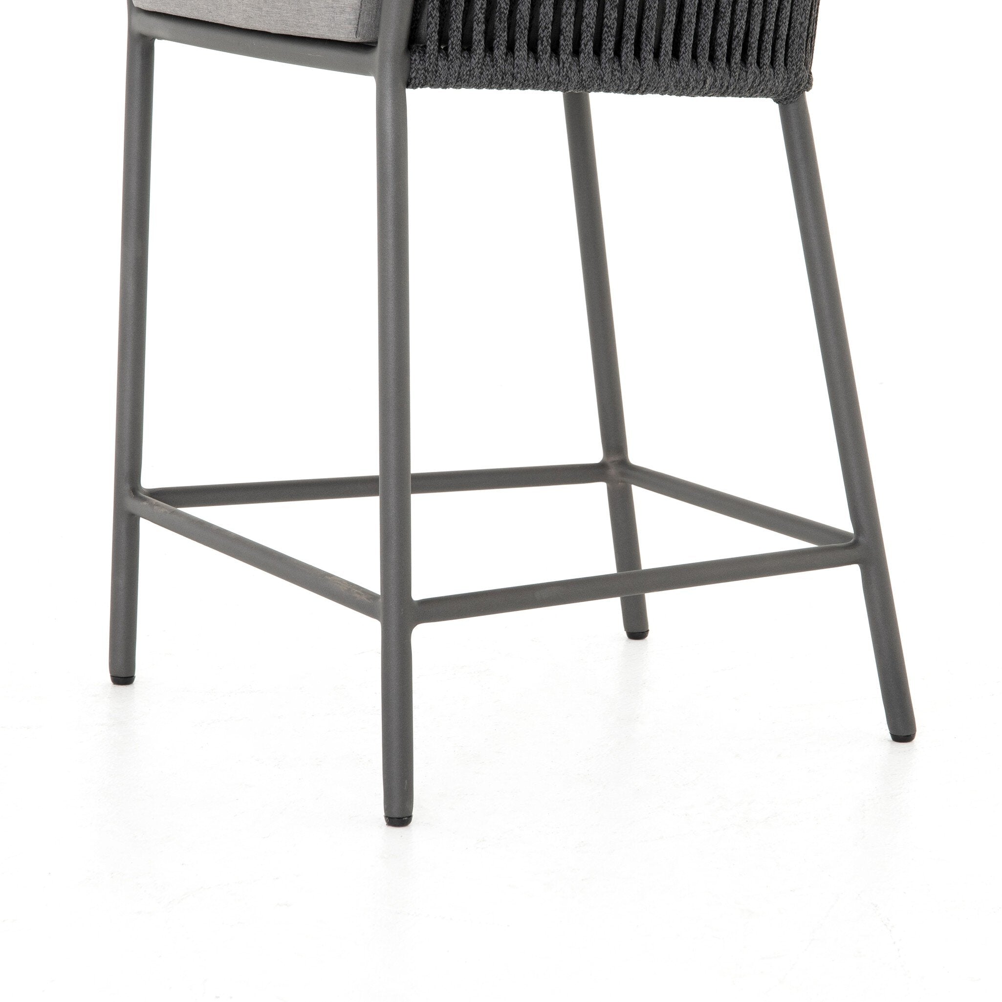 Featuring Porto Venao Charcoal Outdoor Bar & Counter Stool by Four Hands at Amethyst Home. The perfect place for outdoor daydreaming. A beautiful rope-based design is woven across a durable aluminum frame in a rich bronze finish. Topped with a wide cushion and throw pillows, all upholstered in 100% olefin, known for its UV-resistant, water-repellent and quick-drying abilitiesBar S. Amethyst Home provides interior design, new construction, custom furniture, and area rugs in the Nashville metro area
