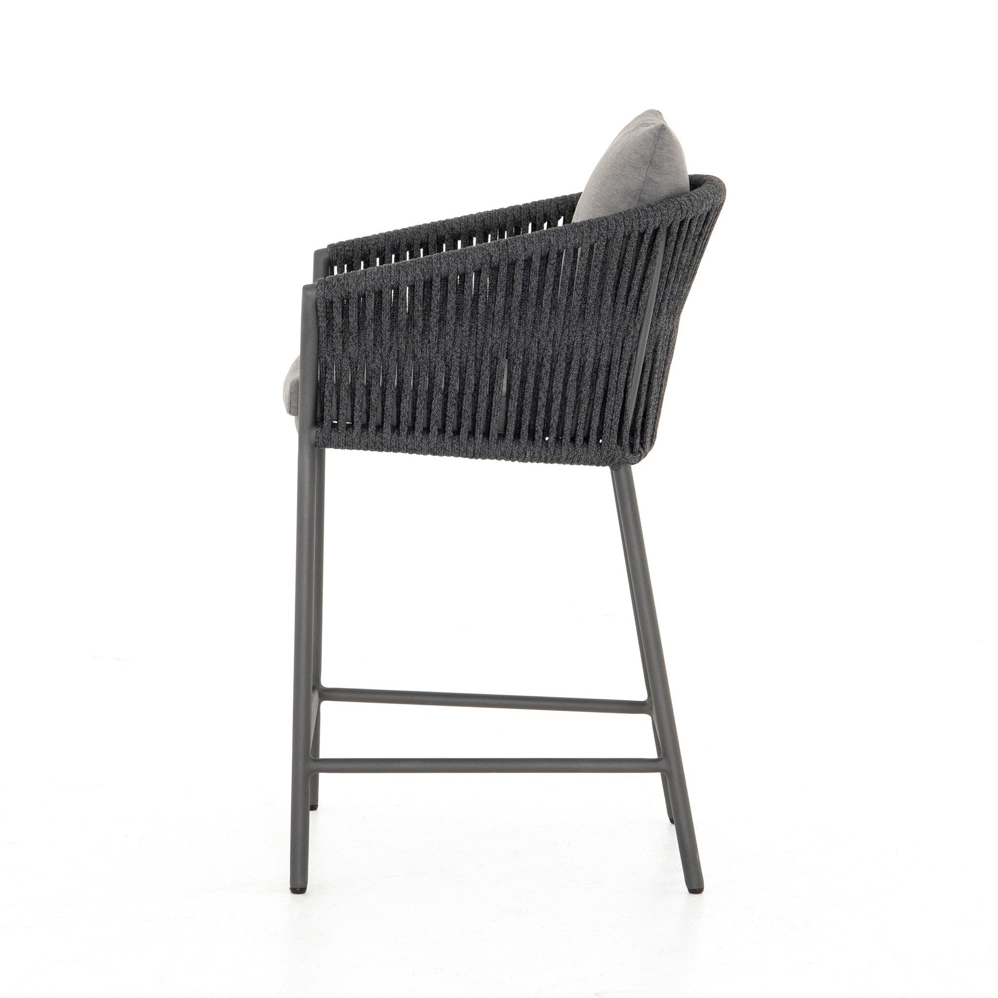 Featuring Porto Venao Charcoal Outdoor Bar & Counter Stool by Four Hands at Amethyst Home. The perfect place for outdoor daydreaming. A beautiful rope-based design is woven across a durable aluminum frame in a rich bronze finish. Topped with a wide cushion and throw pillows, all upholstered in 100% olefin, known for its UV-resistant, water-repellent and quick-drying abilitiesBar S. Amethyst Home provides interior design, new construction, custom furniture, and area rugs in the San Diego metro area