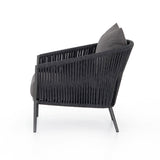 Featuring Porto Venao Charcoal Outdoor Chair by Four Hands at Amethyst Home. The perfect place for outdoor daydreaming. A beautiful rope-based design is woven across a durable aluminum frame in a rich bronze finish. Topped with a wide cushion and throw pillow, all upholstered in 100% olefin, known for its UV-resistant, water-repellent and quick-drying abilities. Cover or store. Amethyst Home provides interior design, new construction, custom furniture, and area rugs in the Newport Beach metro area
