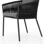 Featuring Porto Venao Charcoal Outdoor Dining Chair by Four Hands at Amethyst Home. The perfect place for outdoor daydreaming. A beautiful rope-based design is woven across a durable aluminum frame in a rich bronze finish. Topped with a wide cushion and throw pillows, all upholstered in 100% olefin, known for its UV-resistant, water-repellent and quick-drying abilitiesOverall Dimensi. Amethyst Home provides interior design, new construction, custom furniture, and area rugs in the Boston metro area