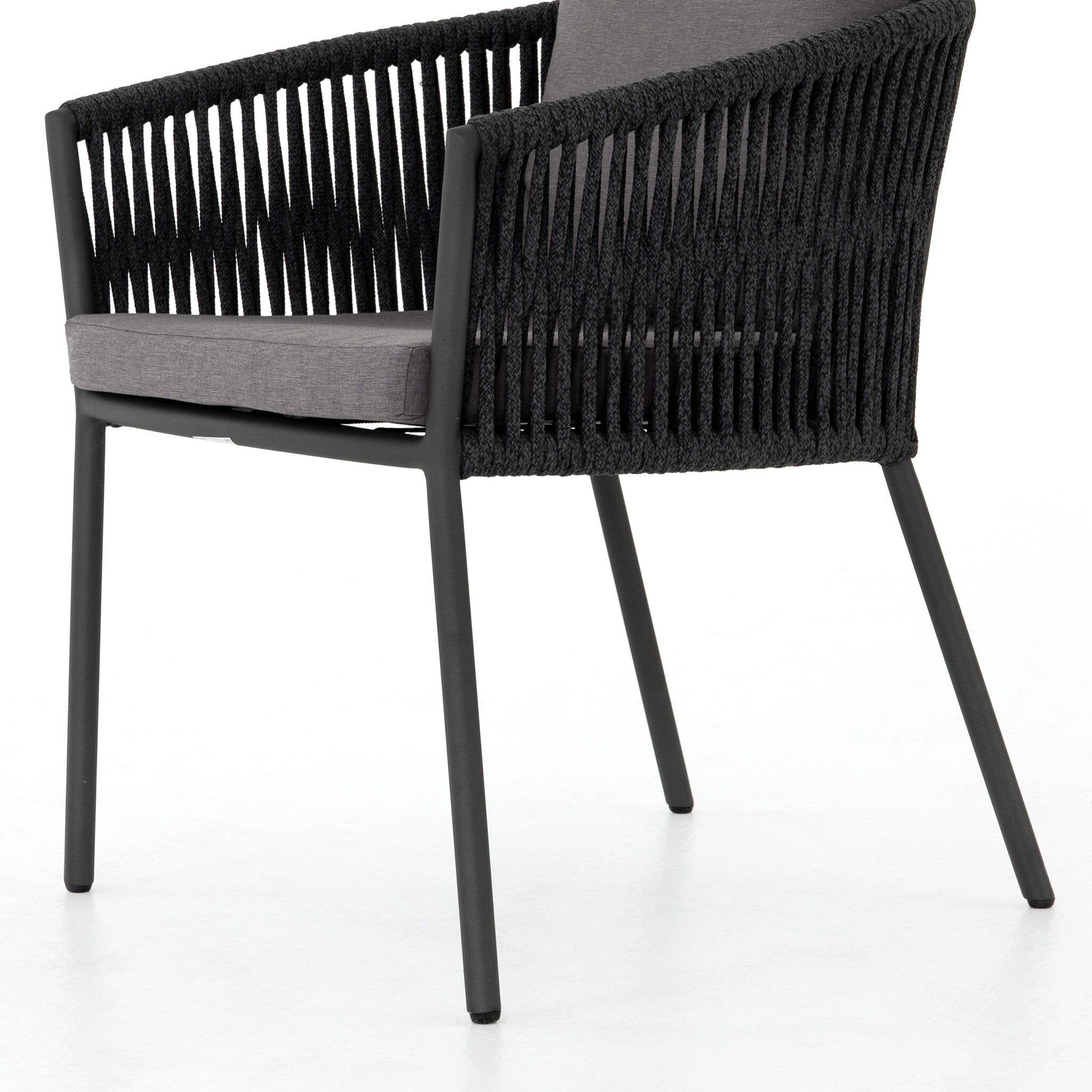 Featuring Porto Venao Charcoal Outdoor Dining Chair by Four Hands at Amethyst Home. The perfect place for outdoor daydreaming. A beautiful rope-based design is woven across a durable aluminum frame in a rich bronze finish. Topped with a wide cushion and throw pillows, all upholstered in 100% olefin, known for its UV-resistant, water-repellent and quick-drying abilitiesOverall Dimensi. Amethyst Home provides interior design, new construction, custom furniture, and area rugs in the Boston metro area
