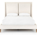 Featuring Potter Dover Crescent Bed by Four Hands at Amethyst Home. Welcome light, livable luxury into your bedroom with a fully upholstered bed. A tapered headboard features a fixed oversized cushion of high-performance fabric, creating a soft, layered look. Understated wooden legs complete the design. Performance fabrics are specially created to withsta. Amethyst Home provides interior design, new home construction design consulting, vintage area rugs, and lighting in the Los Angeles metro area.