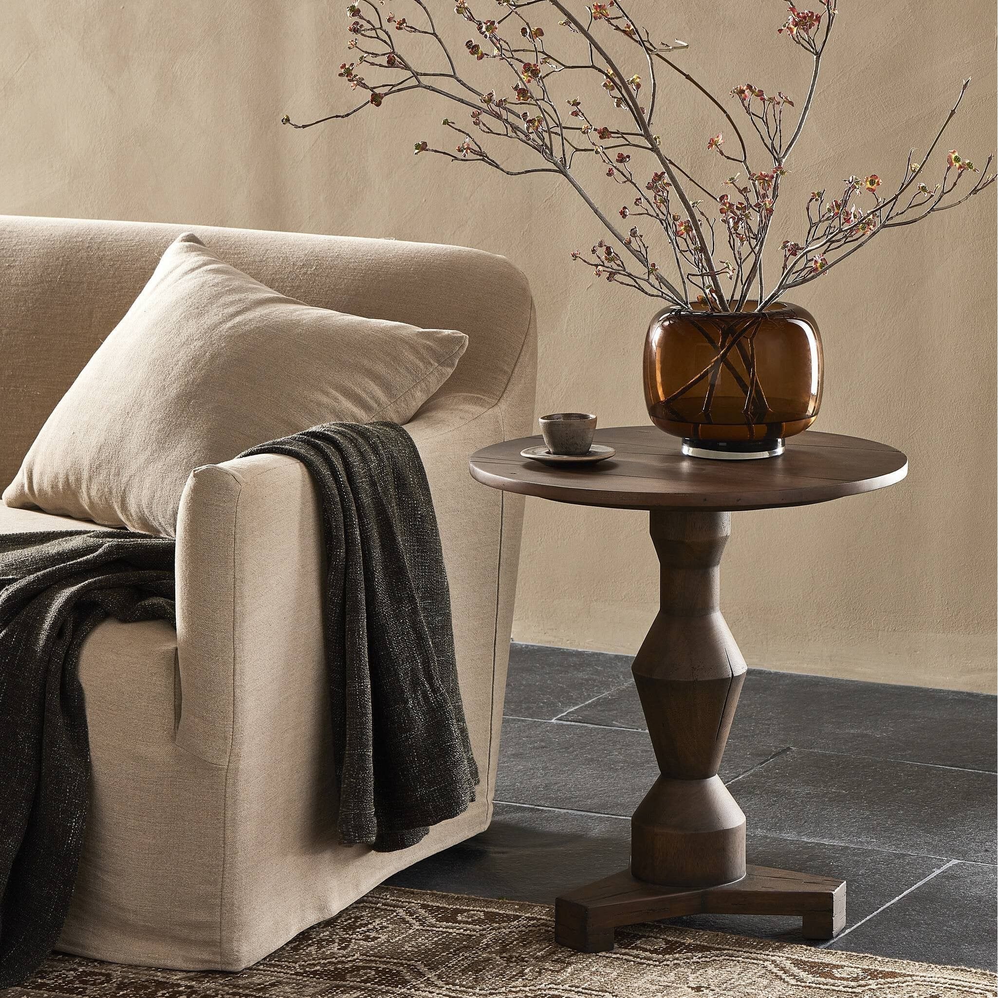 Featuring Rivi Antique Belgium Bleach End Table by Four Hands at Amethyst Home. Simple and sculptural, with a heritage look and feel. A Brancusi-inspired pedestal supports a smooth circular top, showcasing natural knots and grains.Overall Dimensions: 22.00"w x 22.00"d x 24.00"hWeight : 25.79 lbsMaterials : Solid Mixed Reclaimed Wood. Amethyst Home provides interior design, new construction, custom furniture, and area rugs in the Des Moines metro area