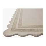 Featuring Chris Loves Julia × Loloi Scottie Ivory / Grey Rug by Loloi at Amethyst Home. The Scottie Collection from Chris Loves Julia x Loloi is a hand-tufted wool area rug with a playful scalloped edge and lower-pile, striped border for a touch of structure. The rugs overall pile is thick and plush, available in easygoing earth tones and neutral colorways. T.  Amethyst Home provides interior design, new home construction design consulting, vintage area rugs, and lighting in the Boston metro area.