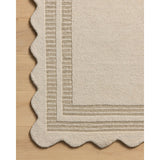Featuring Chris Loves Julia × Loloi Scottie Ivory / Grey Rug by Loloi at Amethyst Home. The Scottie Collection from Chris Loves Julia x Loloi is a hand-tufted wool area rug with a playful scalloped edge and lower-pile, striped border for a touch of structure. The rugs overall pile is thick and plush, available in easygoing earth tones and neutral colorway.  Amethyst Home provides interior design, new home construction design consulting, vintage area rugs, and lighting in the Washington metro area.