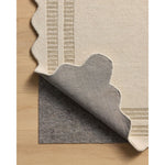 Featuring Chris Loves Julia × Loloi Scottie Ivory / Grey Rug by Loloi at Amethyst Home. The Scottie Collection from Chris Loves Julia x Loloi is a hand-tufted wool area rug with a playful scalloped edge and lower-pile, striped border for a touch of structure. The rugs overall pile is thick and plush, available in easygoing earth tones and neutral colorways. .  Amethyst Home provides interior design, new home construction design consulting, vintage area rugs, and lighting in the Seattle metro area.