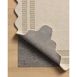 Featuring Chris Loves Julia × Loloi Scottie Ivory / Grey Rug by Loloi at Amethyst Home. The Scottie Collection from Chris Loves Julia x Loloi is a hand-tufted wool area rug with a playful scalloped edge and lower-pile, striped border for a touch of structure. The rugs overall pile is thick and plush, available in easygoing earth tones and neutral colorways. .  Amethyst Home provides interior design, new home construction design consulting, vintage area rugs, and lighting in the Seattle metro area.