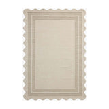 Featuring Chris Loves Julia × Loloi Scottie Ivory / Grey Rug by Loloi at Amethyst Home. The Scottie Collection from Chris Loves Julia x Loloi is a hand-tufted wool area rug with a playful scalloped edge and lower-pile, striped border for a touch of structure. The rugs overall pile is thick and plush, available in easygoing earth tones and neutral colorwa.  Amethyst Home provides interior design, new home construction design consulting, vintage area rugs, and lighting in the Kansas City metro area.