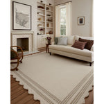 Featuring Chris Loves Julia × Loloi Scottie Ivory / Grey Rug by Loloi at Amethyst Home. The Scottie Collection from Chris Loves Julia x Loloi is a hand-tufted wool area rug with a playful scalloped edge and lower-pile, striped border for a touch of structure. The rugs overall pile is thick and plush, available in easygoing earth tones and neutral color.  Amethyst Home provides interior design, new home construction design consulting, vintage area rugs, and lighting in the Newport Beach metro area.