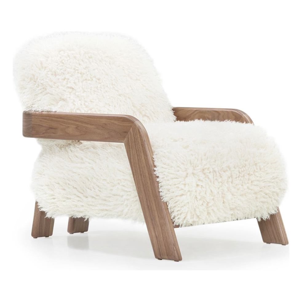 A signature Walnut frame with the coziest vegan sheepskin -- the Elodie chair is the latest dreamy introduction by Verellen. Amethyst Home provides interior design, new home construction design consulting, vintage area rugs, and lighting in the Omaha metro area.