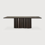 Featuring Sequence Mahogany Dark Brown Dining Table by Ethnicraft at Amethyst Home. Inspired by the rhythmic flow of repetition and variation, the Sequence dining table brings a sense of movement to your space. Solid wooden elements form a sculptural base, where alternating shapes create a balanced interplay of presence and openness. A smooth tabletop provides a quiet contrast, groun. Amethyst Home provides interior design, new construction, custom furniture, and area rugs in the Boston metro area