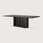 Featuring Sequence Mahogany Dark Brown Dining Table by Ethnicraft at Amethyst Home. Inspired by the rhythmic flow of repetition and variation, the Sequence dining table brings a sense of movement to your space. Solid wooden elements form a sculptural base, where alternating shapes create a balanced interplay of presence and openness. A smooth tabletop provides a quiet contrast, gr. Amethyst Home provides interior design, new construction, custom furniture, and area rugs in the Charlotte metro area