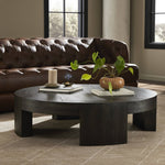 Featuring Sheffield Charcoal Oak Veneer Coffee Table by Four Hands at Amethyst Home. Made from thick, charcoal-finished oak, a rounded coffee table features four legs that pull through to the top, for an intriguing design detail.Overall Dimensions: 48.00"w x 48.00"d x 13.00"hWeight : 94.80 lbsMaterials : Oak Veneer. Amethyst Home provides interior design, new construction, custom furniture, and area rugs in the Charlotte metro area