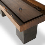 Featuring Shuffleboard Carbonized Black Table by Four Hands at Amethyst Home. This elevated shuffleboard table features a book-matched Guanacaste play surface with intricate laser-etched details, paired with steel and Guanacaste pucks. Aged metal accents highlight the design, all supported by three sleek, tapered bases. Regular care with shuffleboard waxes is required for optimal . Amethyst Home provides interior design, new construction, custom furniture, and area rugs in the Calabasas metro area