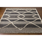 Bring a touch of global-inspired sophistication to your living space with the Cadiz Handmade Rug. This hand knotted wool rug has a plush pile, offering an inviting feel underfoot. The fringe detail adds texture and visual interest, while its Moroccan-style pattern gives this piece a timeless yet modern look. Amethyst Home provides interior design, new home construction design consulting, vintage area rugs, and lighting in the Monterey metro area.