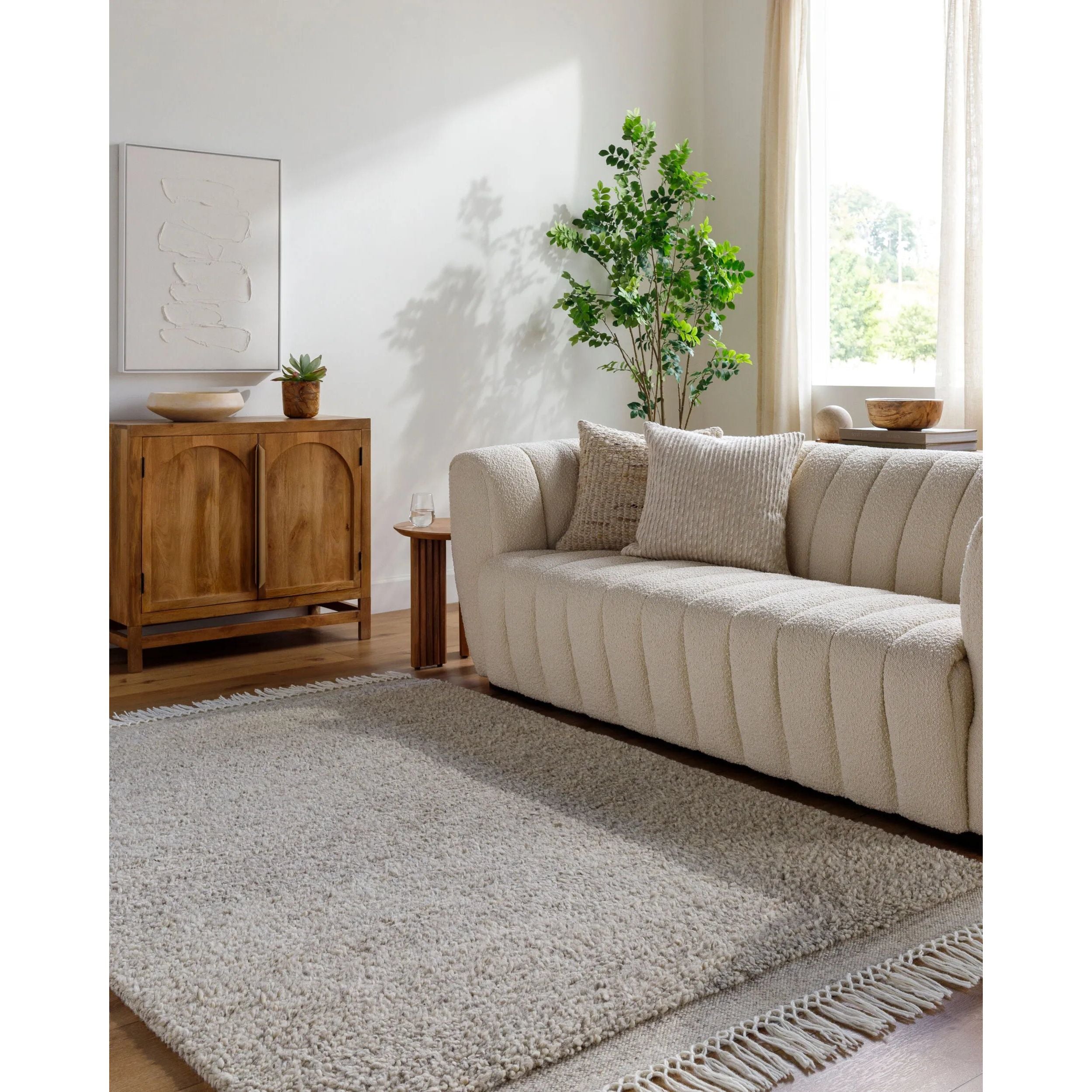 Introducing the Mabel Collection, where Country Cottage meets chic comfort. This handmade rug boasts a high pile construction, hand-woven from pure wool in the heartland of India, ensuring a plush and comfortable surface to walk on. It comes with an appealing fringe detail that adds a touch of rustic charm to any room. Amethyst Home provides interior design, new home construction design consulting, vintage area rugs, and lighting in the Park City metro area.