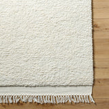 Introducing the Mabel Collection, where Country Cottage meets chic comfort. This handmade rug boasts a high pile construction, hand-woven from pure wool in the heartland of India, ensuring a plush and comfortable surface to walk on. It comes with an appealing fringe detail that adds a touch of rustic charm to any room. Amethyst Home provides interior design, new home construction design consulting, vintage area rugs, and lighting in the Tampa metro area.