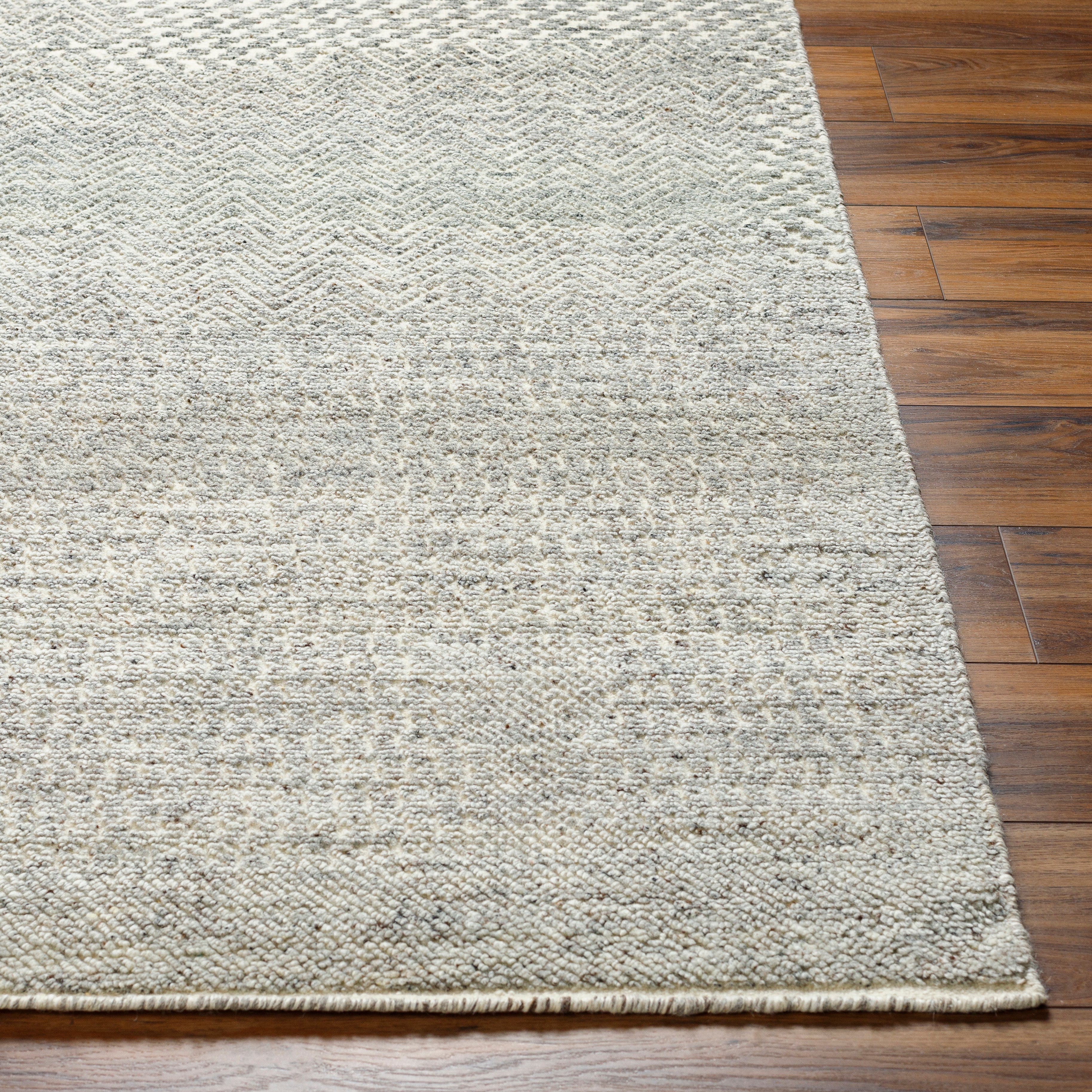 The Tunus Pewter Rug features a globally inspired design made from wool. The hand-knotted rug adds wabi sabi charm to any room. Amethyst Home provides interior design, new home construction design consulting, vintage area rugs, and lighting in the Kansas City metro area.