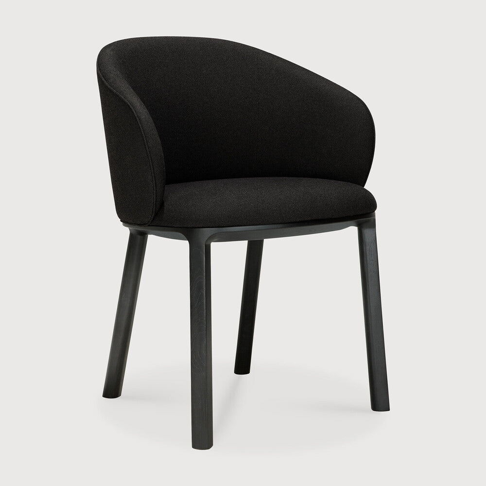 Featuring Unda Charcoal Oak Black Dining Chair by Ethnicraft at Amethyst Home. Experience dining comfort like never before with the Unda. Defined by its blend of materials, fluid lines and crafted piping trace the contours of the upholstered shell. Designed by Studio Segers, known for their pure and honest approach, every detail—down to the uniquely shaped legs—reflects sophisti. Amethyst Home provides interior design, new construction, custom furniture, and area rugs in the Kansas City metro area