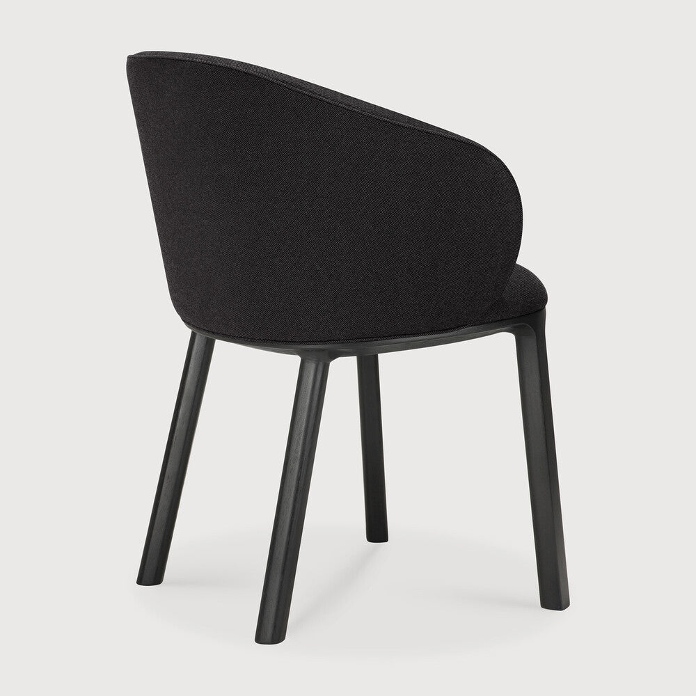 Featuring Unda Charcoal Oak Black Dining Chair by Ethnicraft at Amethyst Home. Experience dining comfort like never before with the Unda. Defined by its blend of materials, fluid lines and crafted piping trace the contours of the upholstered shell. Designed by Studio Segers, known for their pure and honest approach, every detail—down to the uniquely shaped legs—reflects sophistication. Amethyst Home provides interior design, new construction, custom furniture, and area rugs in the Omaha metro area