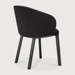 Featuring Unda Charcoal Oak Black Dining Chair by Ethnicraft at Amethyst Home. Experience dining comfort like never before with the Unda. Defined by its blend of materials, fluid lines and crafted piping trace the contours of the upholstered shell. Designed by Studio Segers, known for their pure and honest approach, every detail—down to the uniquely shaped legs—reflects sophistication. Amethyst Home provides interior design, new construction, custom furniture, and area rugs in the Omaha metro area