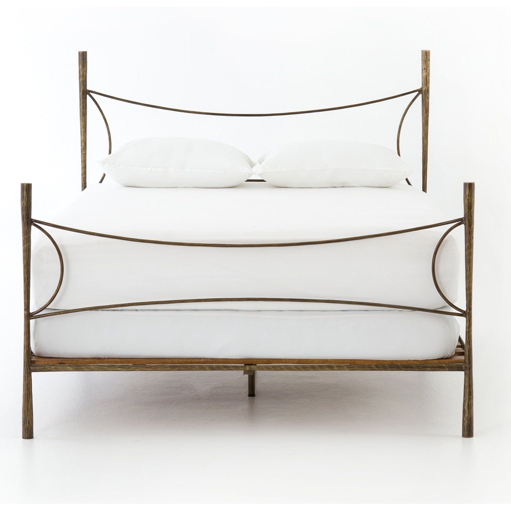 Featuring Westwood Bed by Four Hands at Amethyst Home. Beguiling curves soften hard materials for marked drama with this Westwood Bed. Slim, hammered iron is finished in antique brass for depth that defies this frame's feminine air. Low-profile box spring recommended.
Colors: Antique BrassMaterials: Iron
Queen Overall Dimensions:  62.00"w x 84.00"d x 51.00.  Amethyst Home provides interior design, new home construction design consulting, vintage area rugs, and lighting in the Park City metro area.