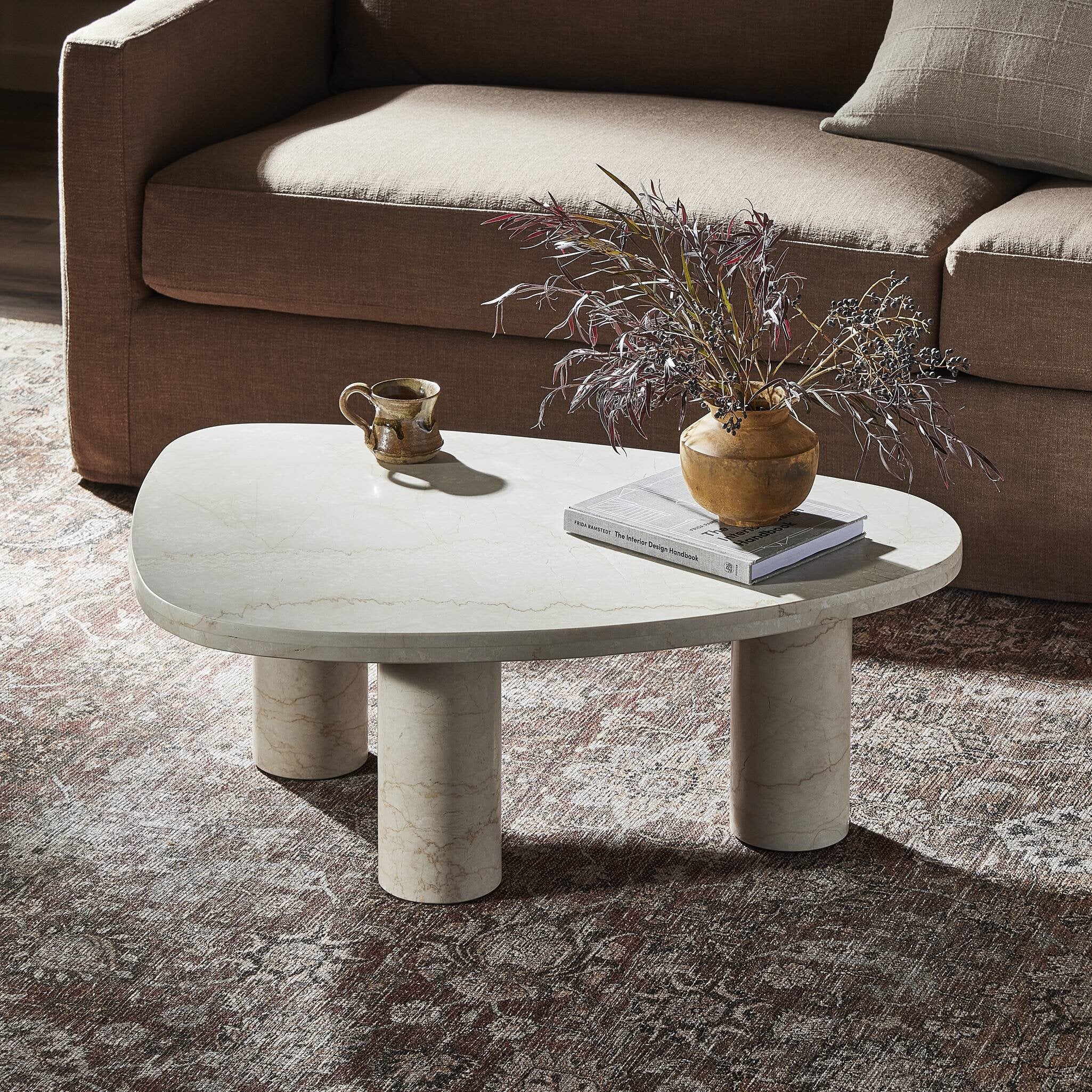 Featuring Zion Cream Marble Coffee Table by Four Hands at Amethyst Home. Upgrade your living room with our Zion Cream Marble Coffee Table, a sleek and sophisticated addition to any modern home. The high-quality marble material and expert craftsmanship ensure durability and timeless elegance. Elevate your space with this luxurious coffee table and impress your guests.
Overall Dimen. Amethyst Home provides interior design, new construction, custom furniture, and area rugs in the Nashville metro area