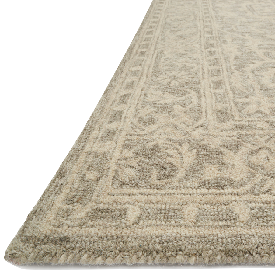 Finely hooked of 100% wool, the carefully crafted Loloi Lyle Stone Area Rug, or LK-02, is acclaimed for its soft texture and muted color range. Each piece showcases space-dyed wool, which lends a subtle gradation of hues throughout the traditional motifs. 