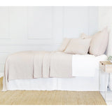Crafted in Portugal, the Ojai matelasse by Pom Pom at Home is light and casual, bringing comfort with its subtle diamond pattern. The coziest bedding to climb into after a long day.  King lounger 100% cotton. Amethyst Home provides interior design, new home construction design consulting, vintage area rugs, and lighting in the Dallas metro area.