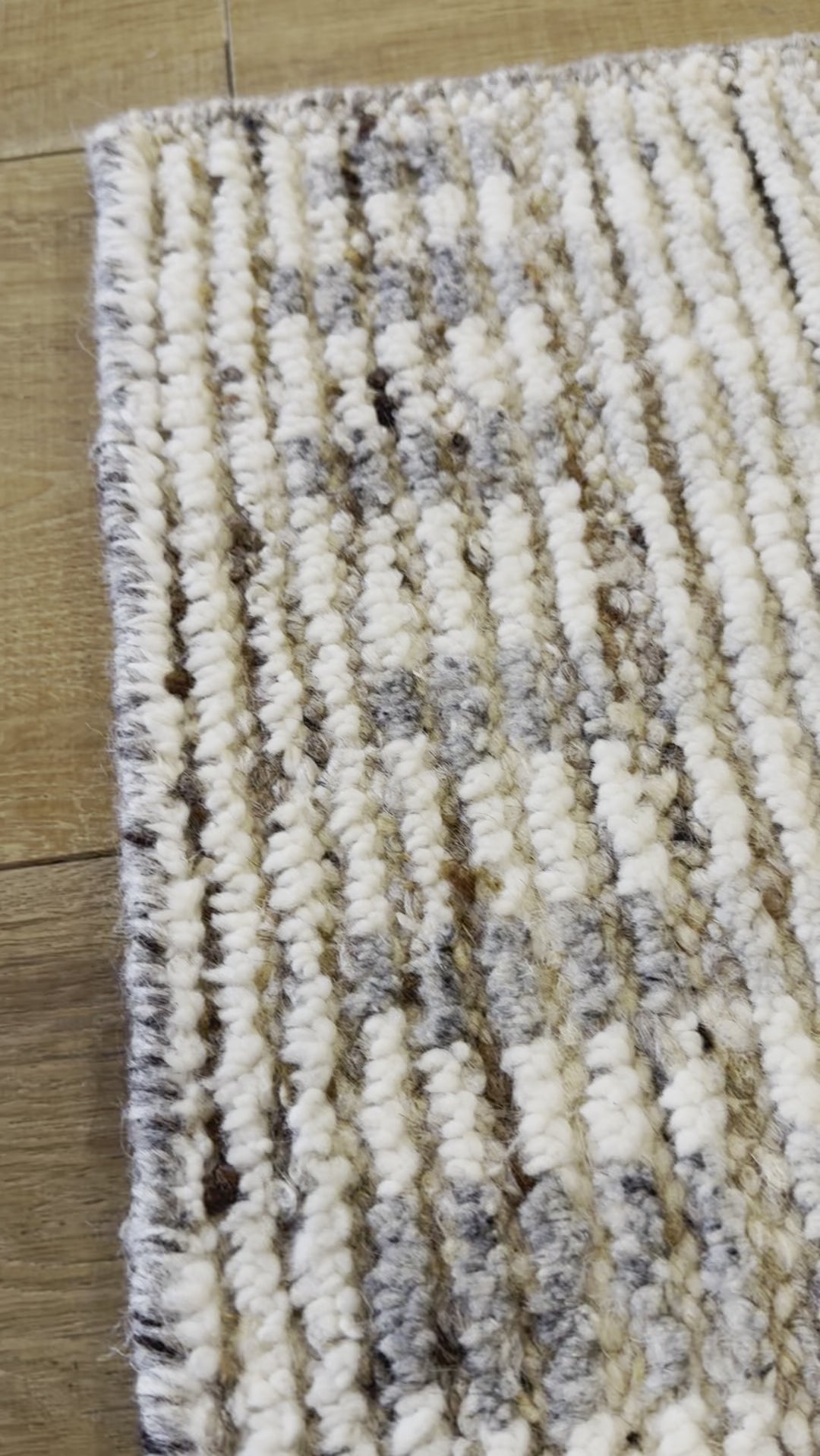 Subtle linear textures and natural colorways define the irresistible quality of the Seora collection. The Camino area rug features a series of perpendicular, striped lines for an intriguing dose of modern appeal. The textural, wool pile contains no dye, reflecting the natural colors of the sheep, for a rich and grounding palette of tan, cream, and flecks of brown and gray. Amethyst Home provides interior design, new construction, custom furniture, and area rugs in the Kansas City metro area.