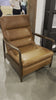 A sleek seat with hidden push-back reclining functionality. This midcentury-inspired recliner features wide chunky channeling paired with slim paddle arms and a tapered wood frame. Designed with a high seat and high back for extra comfy support. Upholstered in a timeless tobacco-hued leather made in a family-owned tannery in Thailand. Amethyst Home provides interior design, new home construction design consulting, vintage area rugs, and lighting in the Calabasas metro area.