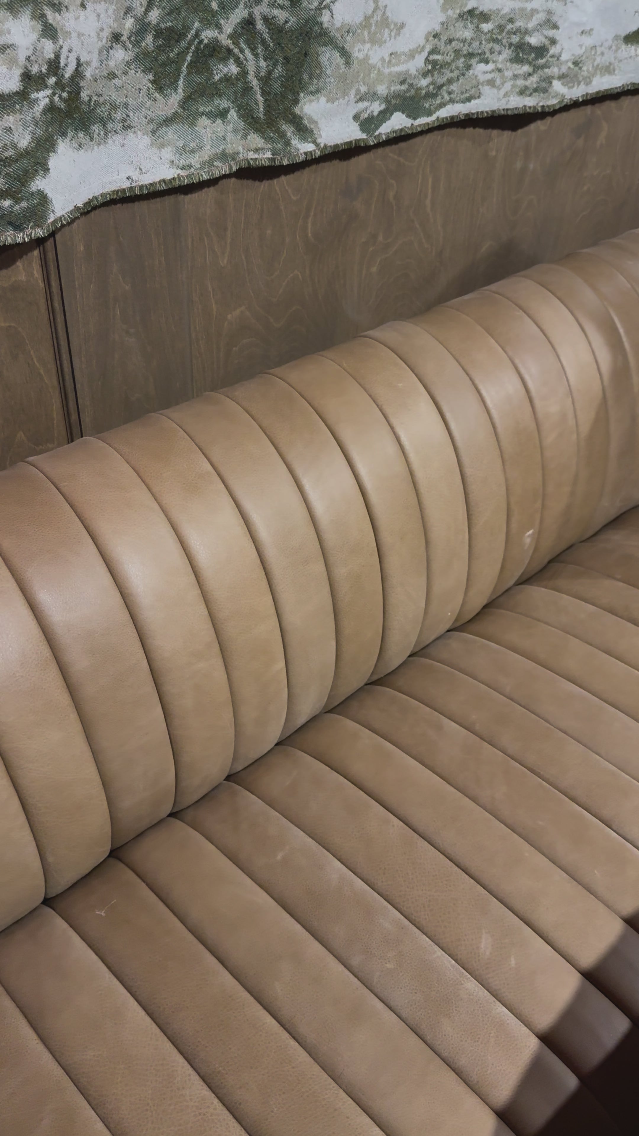 The armless dining bench is elevated with tan top-grain leather with a beautifully pronounced grain, plus dramatic channeling for a linear look. Perfectly sized for larger tables or spaces.Overall Dimensions:49" Bench: 49.00"w x 28.00"d x 31.50"hChair: 25.00"w x 28.00"d x 31.50"hCorner Chair: 28.00"w x 28.00"d x 31.50"hChair + A Half: 38.50"w x 28.00"d x 31. Amethyst Home provides interior design, new home construction design consulting, vintage area rugs, and lighting in the Scottsdale metro area.