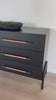 Introducing the Rosedale Ebony Oak Veneer 8 Drawer Dresser - the epitome of luxury and sophistication. With its sleek ebony oak veneer finish and 8 spacious drawers, this dresser is the perfect addition to any elegant bedroom. Organize your clothes and elevate your decor with this stunning piece. Amethyst Home provides interior design, new home construction design consulting, vintage area rugs, and lighting in the Nashville metro area.
