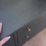 Woven black raffia offers a texture-driven take on bedroom storage. Antique brass-finished iron hardware adorns six spacious drawers, all supported by a solid mahogany base.Overall Dimensions: 62.00"w x 17.00"d x 34.00"hWeight : 181.22 lbsMaterials : Solid Mahogany, Sugar Palm, Iron Amethyst Home provides interior design, new home construction design consulting, vintage area rugs, and lighting in the Kansas City metro area.