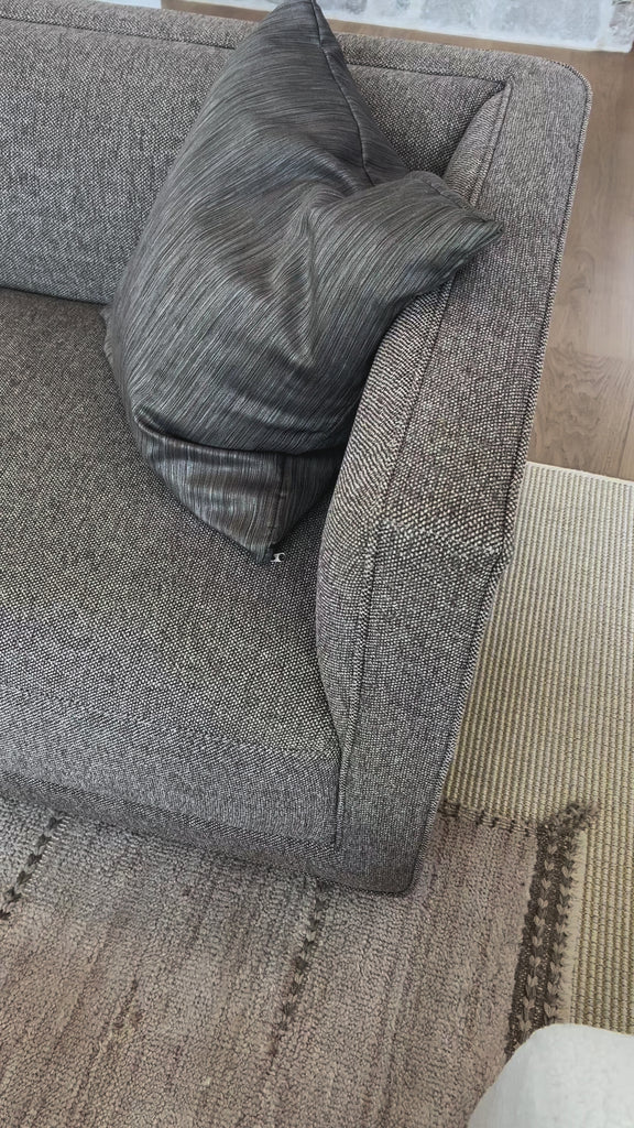This Phillip Delta Tweed Sofa provides comfort and style in one piece. Crafted with high-quality materials and designed with ergonomic support in mind, this sofa is perfect for relaxing or entertaining. Its classic tweed fabric adds a touch of sophistication to any living space. Amethyst Home provides interior design, new home construction design consulting, vintage area rugs, and lighting in the Austin metro area.
