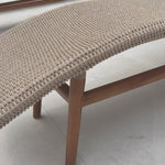Strike a pose. Based off a vintage shape, all-weather wicker is subtly curved and set atop a minimal frame made of solid teak. A stylish statement piece and seating option for both indoors and out. Cover or store inside during inclement weather and when not in use.Overall Dimensions: 24.00"w x 80.50"d x 27.50"hWeight : 55. Amethyst Home provides interior design, new home construction design consulting, vintage area rugs, and lighting in the Des Moines metro area.