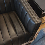Upholstered in dreamy "wolf" leather -- this sofa is the perfect blend of chocolate and grey tones.  Channeled leather makes for a structured, comfortable sit. Amethyst Home provides interior design, new home construction design consulting, vintage area rugs, and lighting in the Alpharetta metro area.