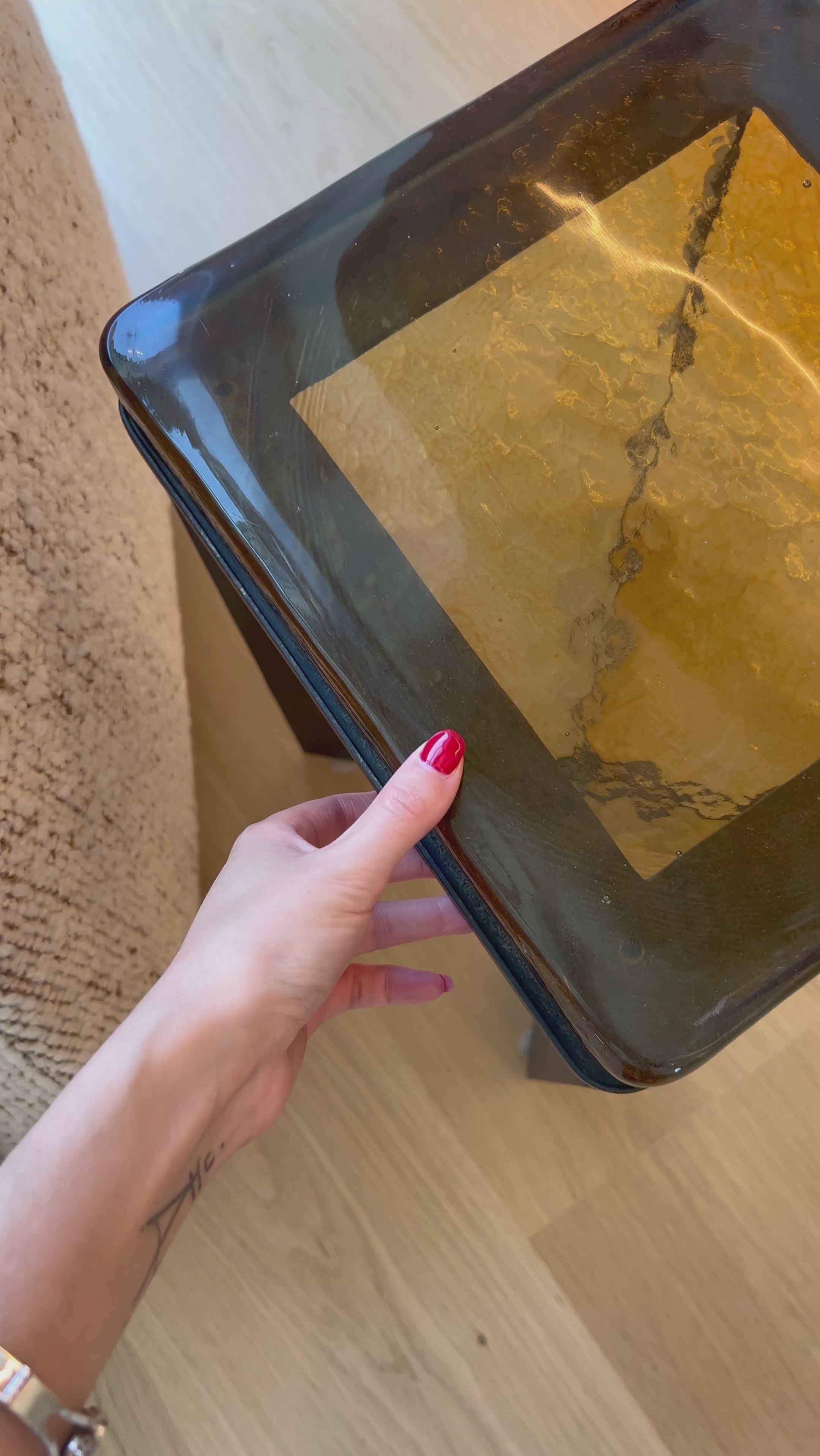 An airy, angular base of charcoal-burnished iron supports a squared tabletop of amber cast glass, perfectly sized to keep your drink or book within reach.Overall Dimensions: 12.50"w x 12.50"d x 22.00"hWeight : 36.38 lbsMaterials : Cast Glass, Iron Amethyst Home provides interior design, new home construction design consulting, vintage area rugs, and lighting in the Monterey metro area.