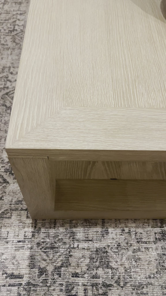 Made from bleached solid oak, a simply shaped coffee table brings a light, clean look to your living room. Lower shelving brings bonus storage and display of favorite books and more.Overall Dimensions: 67"W x 40"L x 15.75"H Amethyst Home provides interior design, new home construction design consulting, vintage area rugs, and lighting in the Kansas City metro area.