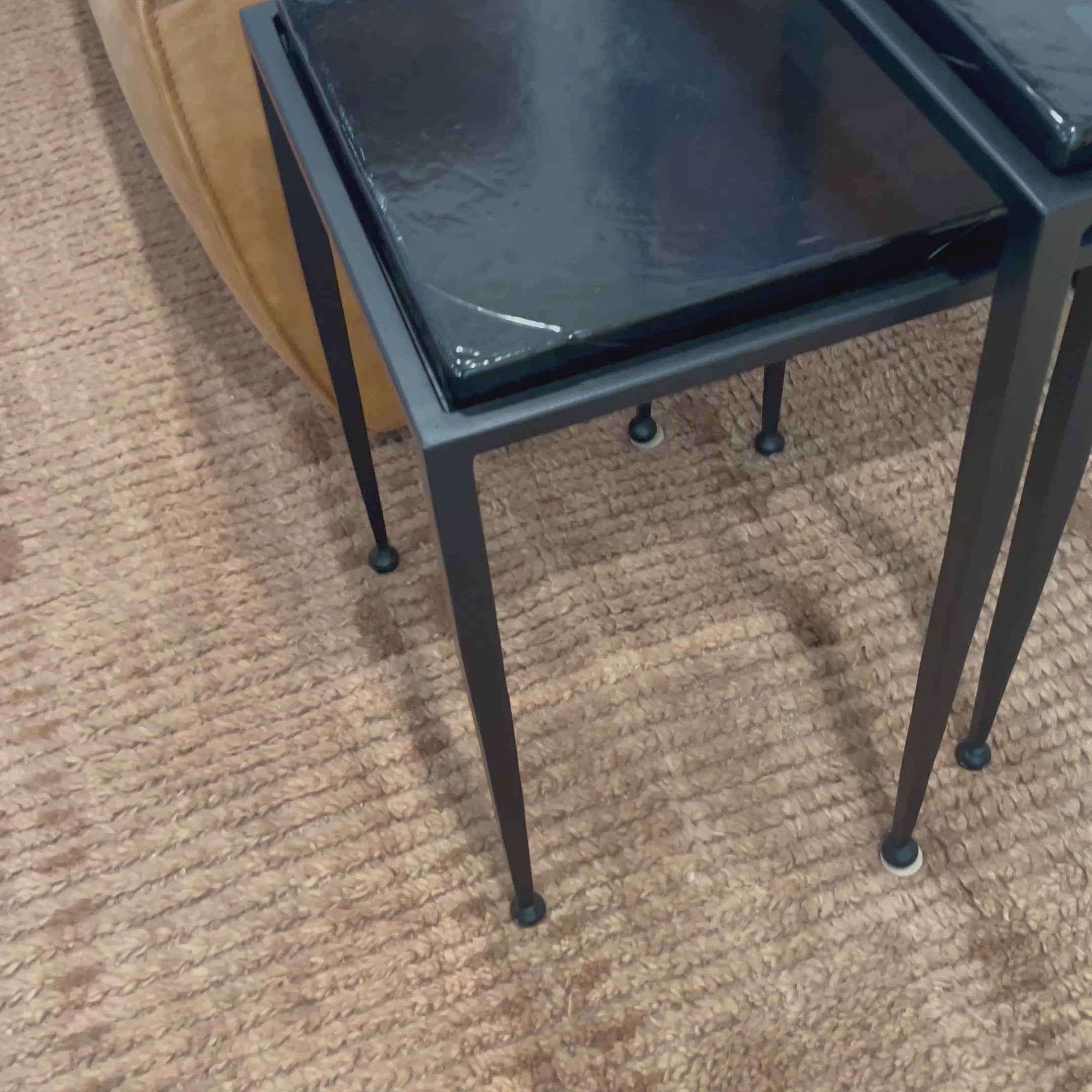 Embrace the mysterious with the Dexter smoked glass nesting tables.  Beautiful smoked glass gives a warm modern vibe while being practical.Overall Dimensions: 16.25"w x 16.25"d x 21.00"hWeight : 52.91 lbsMaterials : Cast Glass, Iron Amethyst Home provides interior design, new home construction design consulting, vintage area rugs, and lighting in the Winter Garden metro area.