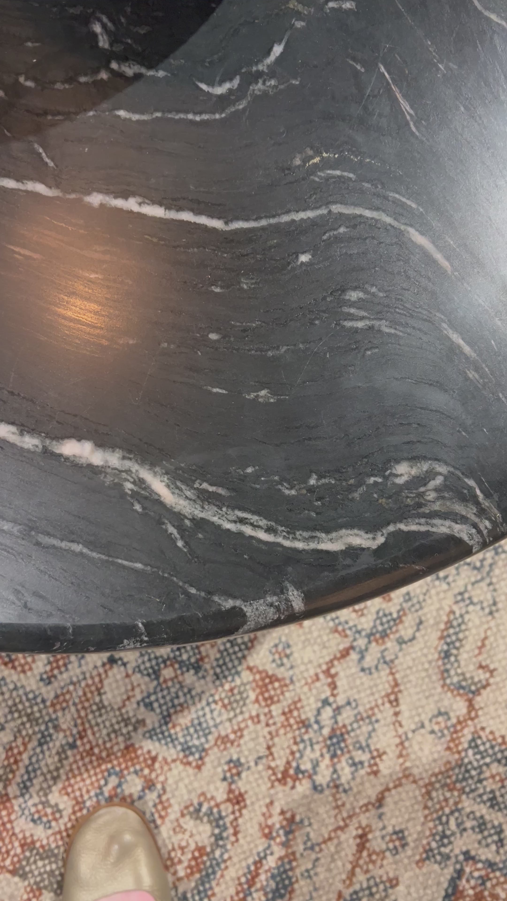 Inspired by Italian design, a swirling marble base is scalloped for a linear look with heavy texture. Topped with polished black marble.Overall Dimensions: 20"W x 20"L x 20"H Amethyst Home provides interior design, new home construction design consulting, vintage area rugs, and lighting in the Des Moines metro area.