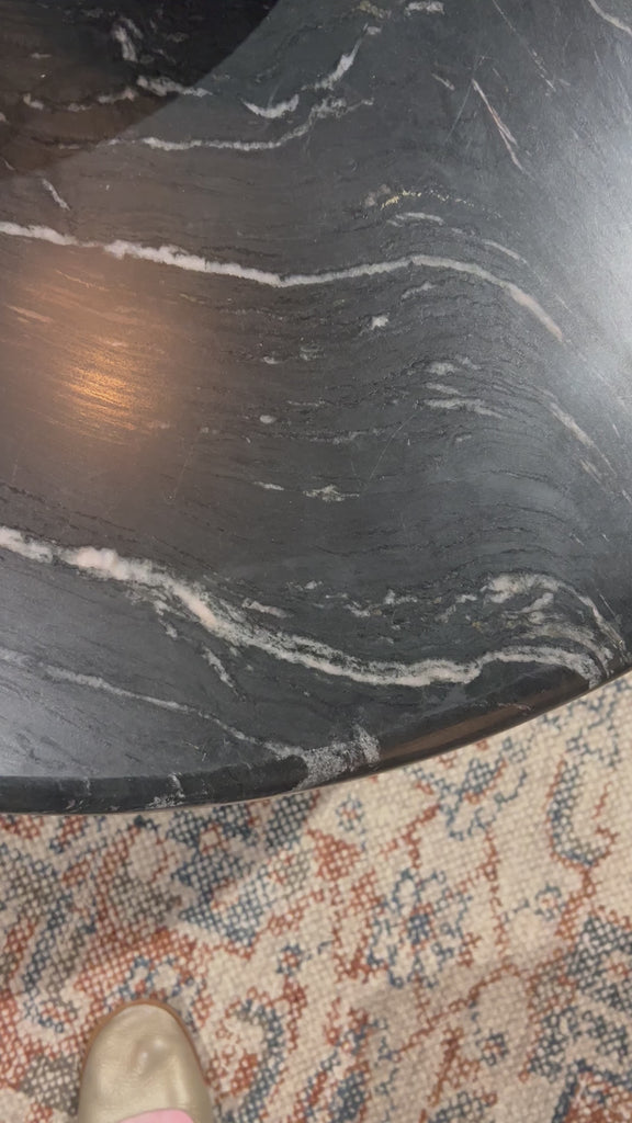 Inspired by Italian design, a swirling marble base is scalloped for a linear look with heavy texture. Topped with polished black marble.Overall Dimensions: 20"W x 20"L x 20"H Amethyst Home provides interior design, new home construction design consulting, vintage area rugs, and lighting in the Des Moines metro area.