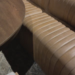 The beauty of this modular piece is that the vertical channeling makes for a cohesive feel despite being modular. Your new favorite place to enjoy morning coffee. A U-shaped dining banquette is upholstered in tan top-grain leather with a beautifully pronounced grain and dramatic channeling for a linear look.Overall Dimensions: 119.50"w x 66.50"d x 31. Amethyst Home provides interior design, new home construction design consulting, vintage area rugs, and lighting in the Salt Lake City metro area.