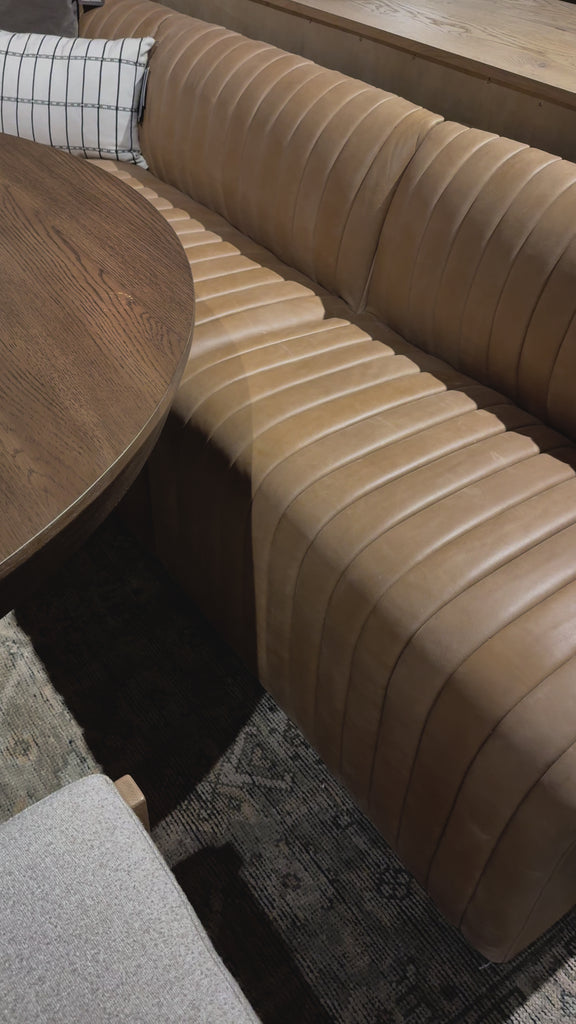 The beauty of this modular piece is that the vertical channeling makes for a cohesive feel despite being modular. Your new favorite place to enjoy morning coffee. A U-shaped dining banquette is upholstered in tan top-grain leather with a beautifully pronounced grain and dramatic channeling for a linear look.Overall Dimensions: 119.50"w x 66.50"d x 31. Amethyst Home provides interior design, new home construction design consulting, vintage area rugs, and lighting in the Salt Lake City metro area.