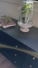 Woven black raffia offers a texture-driven take on bedroom storage. Antique brass-finished iron hardware adorns six spacious drawers, all supported by a solid mahogany base.Overall Dimensions: 62.00"w x 17.00"d x 34.00"hWeight : 181.22 lbsMaterials : Solid Mahogany, Sugar Palm, Iron Amethyst Home provides interior design, new home construction design consulting, vintage area rugs, and lighting in the Newport Beach metro area.