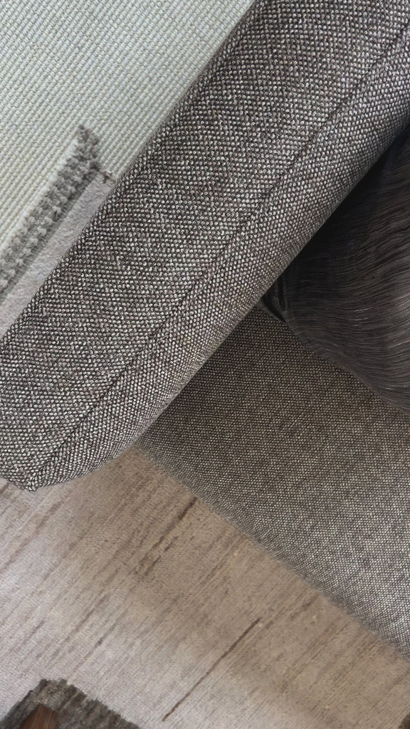 This Phillip Delta Tweed Sofa provides comfort and style in one piece. Crafted with high-quality materials and designed with ergonomic support in mind, this sofa is perfect for relaxing or entertaining. Its classic tweed fabric adds a touch of sophistication to any living space. Amethyst Home provides interior design, new home construction design consulting, vintage area rugs, and lighting in the Winter Garden metro area.