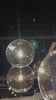 Clear glass spheres dangle at varying lengths for a stunning effect. Each globe is individually blown, shaped and sculpted by hand through a one-hour process. The finish on the brass frame is achieved through a specialized process that turns the brass into an almost black hue before the rod is polished smooth. Brass and glass are 98% recyclable. Amethyst Home provides interior design, new home construction design consulting, vintage area rugs, and lighting in the Alpharetta metro area.