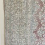 Whitewashed pastels hues on one side, flip for intense pinks and blues!  Hand knotted, 100% wool - perfect for high traffic areas.
